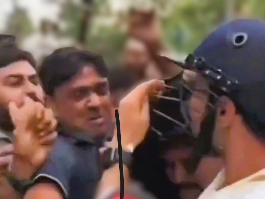 Security personnel escorting TMC MP Abhishek Banerjee away from a crowd after a mob attack in Sonarpur, West Bengal amid rising political tensions
